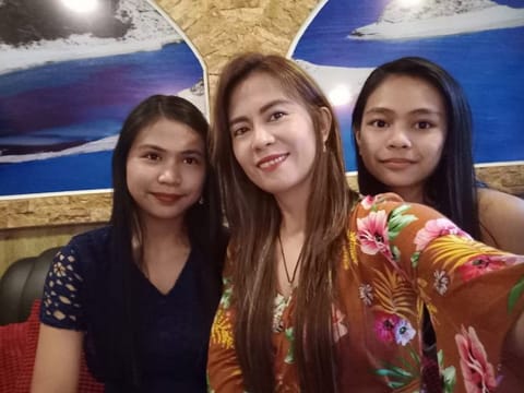 Maricris, a cancer survivor mum in Dubai, with daughters Francine and Ella.