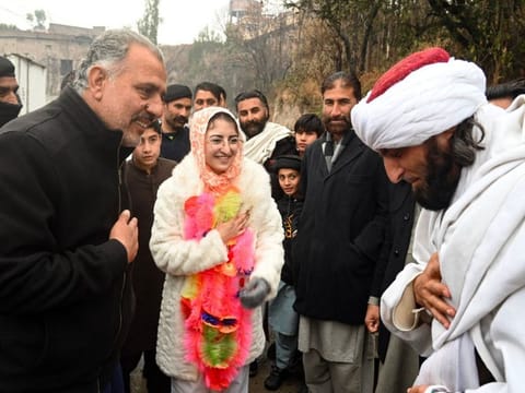 Saveera Parkash, a Hindu minority candidate of the Pakistan Peoples Party (PPP) for provincial assembly, greeting mufti Fazal Ghafoor, candidate of the Jamiat Ulema Islam-Fazal (JUI-F) party, during her election campaign rally in the Buner district of Khyber Pakhtunkhwa province.