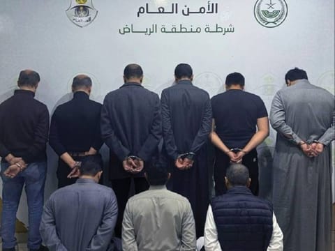 The offenders appear in a police photo after their arrest.