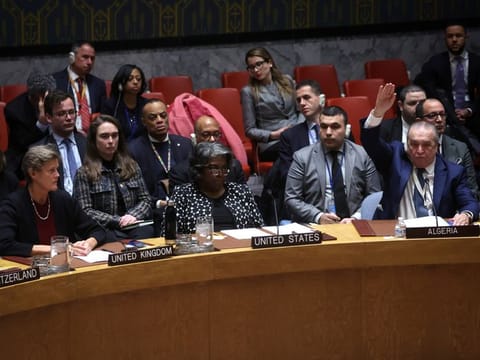 Algeria’s Ambassador to the United Nations Sofiane Mimouni votes in favor as US Ambassador to the United Nations Linda Thomas-Greenfield vetos a vote on a UN Security Council resolution to demand an immediate humanitarian ceasefire in Gaza, at UN headquarters in New York, on February 20, 2024.