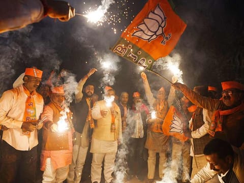 Supporters of India's Bhartiya Janata Party (BJP) celebrate the announcement of Indian Prime Minister Narendra Modi's candidature from Varanasi for the next Lok Sabha elections, outside the BJP office in Varanasi, on March 2, 2024.