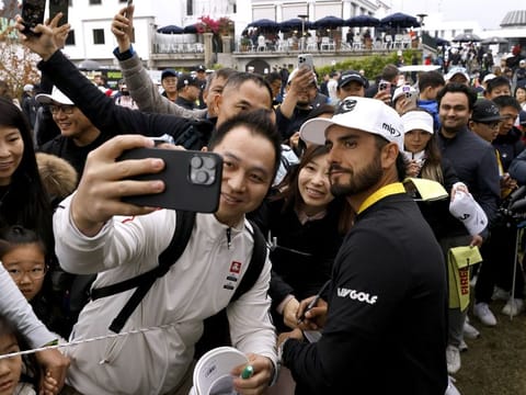 Fireballs GC's Abraham Ancer poses for a selfie with fans at the Hong Kong Golf Club.