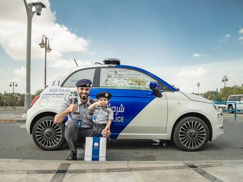The boy was gifted a uniform as he patrolled the streets in a special 'Kids Police' vehicle alongside the official