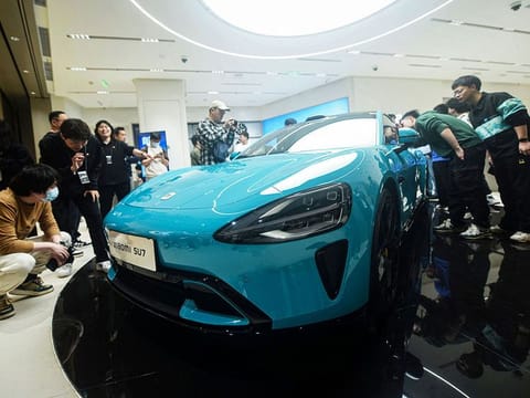 Chinese smartphone maker Xiaomi's first electric car, Xiaomi SU7 model, is seen at a shop in Hangzhou, in eastern China's Zhejiang province on March 25, 2024.