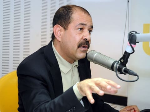Tunisian lawyer and opposition leader Chokri Belaid speaks during a radio interview in Tunis on November 20, 2012.