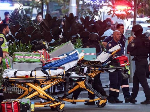 Police enter the Westfield Bondi Junction shopping mall after a stabbing incident in Sydney on April 13, 2024.