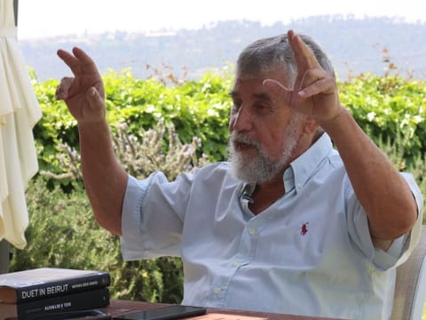 Former Israeli Mossad agent and author Mishka Ben-David is pictured at his home in Ramat Raziel on April 15, 2024.