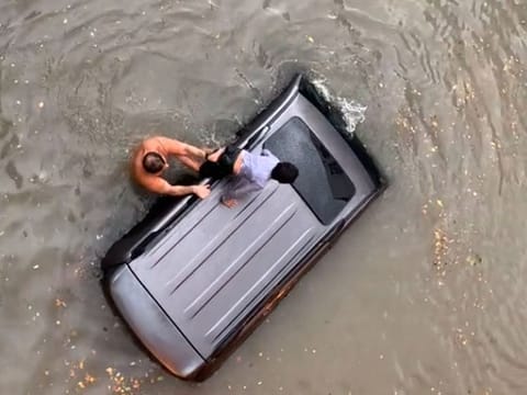 A screengrab of the viral video showing Hazem Sewid saving the eight-year-old boy.