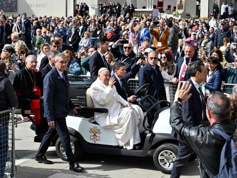Pope Francis waves to the crowd as he arrives to lead a mass at St.Mark's square on April 28, 2024 in Venice.
