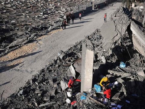 Palestinians salvage belongings from the rubble of a house hit by overnight Israeli bombing in Rafah in the southern Gaza Strip on April 20, 2024, amid the ongoing conflict between Israel and the Hamas movement.