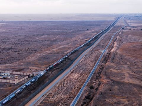 A drone picture of a line of trucks waiting on an Egyptian road along the border with Israel, near the Rafah border crossing with the Gaza Strip.