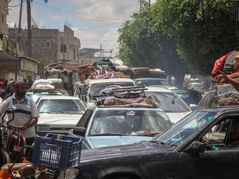 Palestinians flee following Israeli army orders to evacuate the eastern side of the city, ahead of military operations in Rafah, on May 6, 2024.