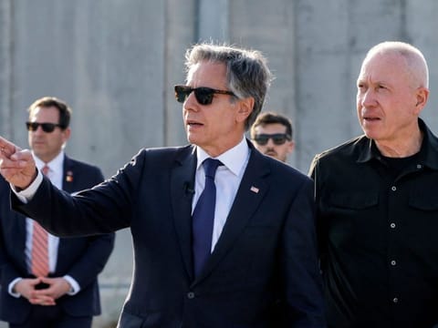 US Secretary of State Antony Blinken gestures as he walks with Israeli Defence Minister Yoav Gallant at the Kerem Shalom border crossing with the Gaza Strip in southern Israel on May 1, 2024.