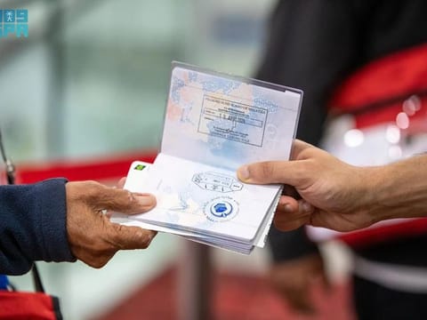 A passport of the pilgrim shows the new stamp.