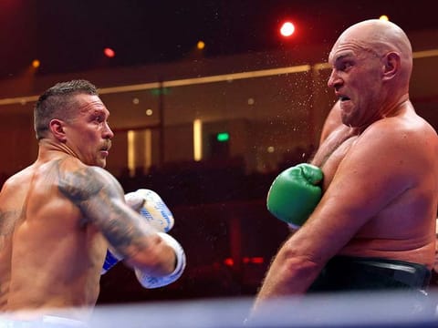 Ukraine's Oleksandr Usyk (left) fights against Britain's Tyson Fury during a heavyweight boxing world championship fight at Kingdom Arena in Riyadh, Saudi Arabia on May 19, 2024. Oleksandr Usyk beat Tyson Fury by split decision to win the world's first undisputed heavyweight championship in 25 years on May 19, 2024, an unprecedented feat in boxing's four-belt era.
