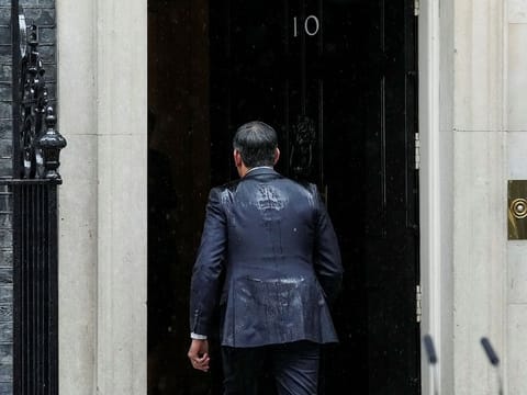 British Prime Minister Rishi Sunak enters Number 10 Downing Street, after delivering a speech calling for a general election, in London, Britain