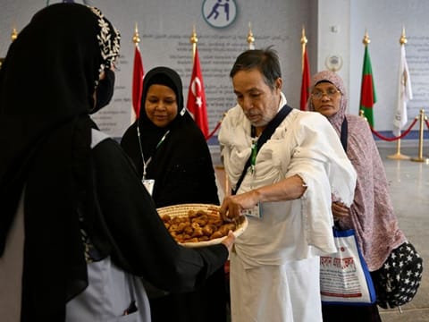 Pilgrims are greeted upon arrival at King Abdul Aziz International Airport in Jeddah.