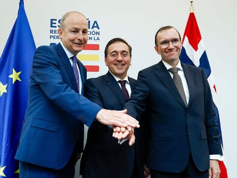 Spanish Minister for Foreign Affairs, European Union and Cooperation, Jose Manuel Albares (centre), Norwegian Foreign Minister Espen Barth Eide (right) and Irish Foreign minister Micheal Martin join hands after holding a joint press conference at the the Permanent Representation of Spain to the European Union in Brussels on May 27, 2024. Ireland, Norway and Spain's governments decided to recognise a Palestinian state.