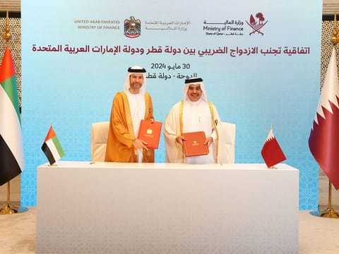 Mohamed Hadi Al Hussaini, UAE Minister of State for Financial Affairs, and Ali bin Ahmed Al Kuwari, Qatari Minister of Finance.
