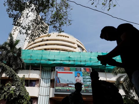 File photo: People watch results for India's general elections on a screen outside the Bombay Stock Exchange (BSE) in Mumbai, on June 4, 2024.