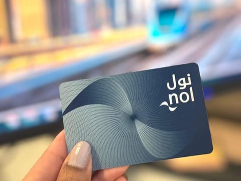 The blue card is a personal card, in which you have your name and photograph added. This is necessary if you are seeking a discounted travel fare as a student or senior citizen. But it is also helpful for regular users, as it keeps your nol card balance secure.