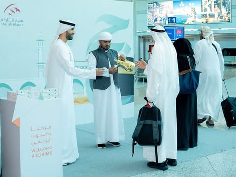 A welcome home ceremony for returning pilgrims at Sharjah Airport