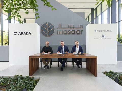 Officials from Arada Reigate Grammar School and Bright Capital Investment sign the partnership agreement at Masaar.