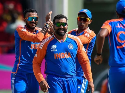 Axar Patel (left), who was adjudged the player of the match, celebrates his wicket with Suryakumar Yadav (right) and skipper Rohit Sharma during the semi-finals against England.