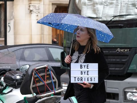 A protester carries a sign with a slogan which reads "Bye Bye Tories!", after the general election, in the Westminster district of London, UK, on Friday, July 5, 2024.
