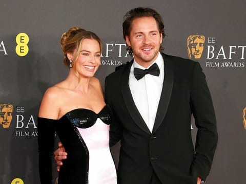 Margot Robbie and Tom Ackerley.