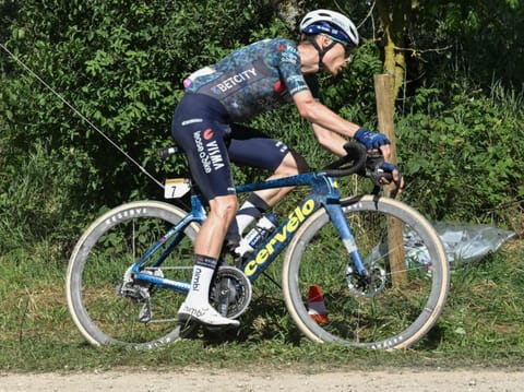 Team Visma - Lease a Bike team's Danish rider Jonas Vingegaard cycles over a "Chemin Blanc" (white road) gravel sector during the 9th stage of the 111th edition of the Tour de France cycling race on Sunday.