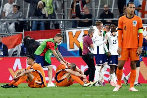 England's defender Kieran Trippier (2nd L), midfielder Tijani Reijnders (L) and defender Stefan de Vrij (3rd L) react after England won the Uefa Euro 2024 semi-final football match at the BVB Stadion in Dortmund on Wednesday.