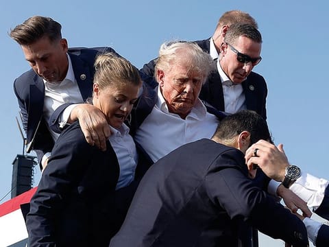 Republican presidential candidate rushed offstage during a rally