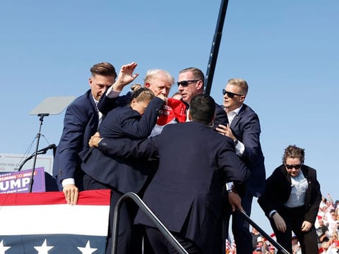 Republican presidential candidate former President Donald Trump is rushed offstage by U.S. Secret Service agents.