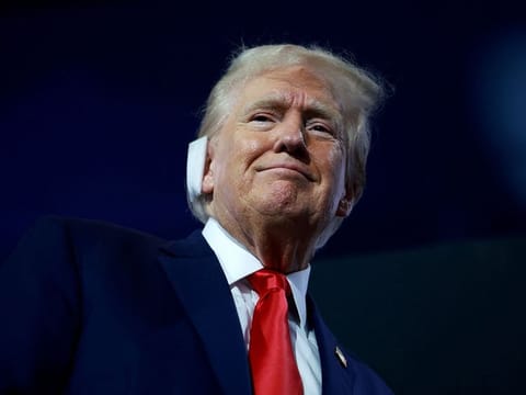 Former US President Donald Trump attends the first day of the Republican National Conventiom.