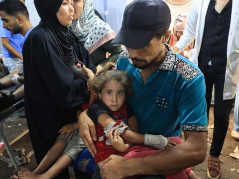 A wounded Palestinian girl is brought to be treated at the Al Awda Hospital in Nuseirat refugee Camp after the Israeli military bombardment of the UNRWA (United Nations Relief and Works Agency for Palestine Refugees) run Abu Araban school, turned shelter, where internally displaced Palestinians are living, in the Nuseirat camp, in the central Gaza Strip on July 14, 2024.