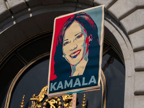A supporter holds a sign as members of the San Francisco Democratic Party rally in support of Kamala Harris.