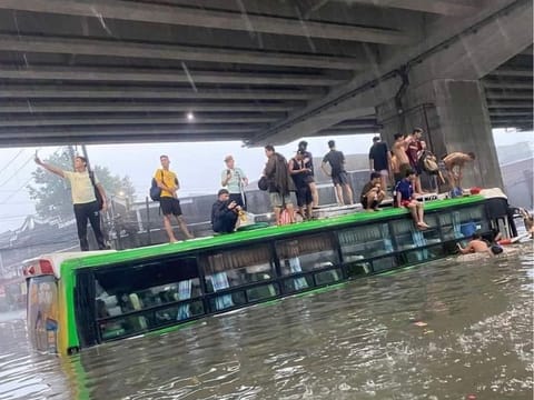 Filipino citizen Reyna Valmores shared this photo showing a flooded bus and people on top of it. Authorities have deployed emergency workers for search and rescue operations. Many passengers were stranded due to severe rains brought by the “Habagat” season to Metro Manila and the National Capital Region. File photo.
