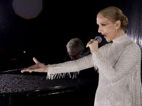 A grab of a video released by the Olympic Broadcasting Services shows Canadian Singer Celine Dion performing on the Eiffel Tower during the opening ceremony of the Paris 2024 Olympic Games, in Paris, on July 26, 2024