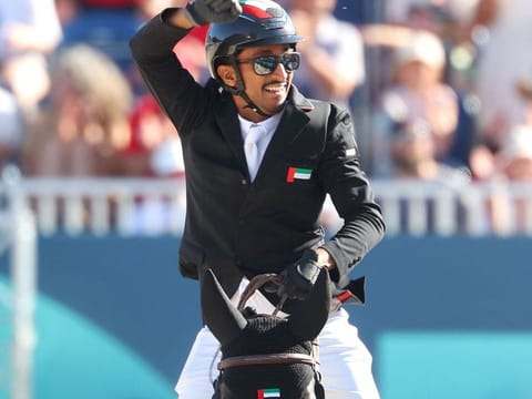 United Arab Emirates' Omar Abdul Aziz Al Marzooqi with horse Enjoy de la Mure reacts after competing in the equestrian's jumping individual qualifier during the Paris 2024 Olympic Games at the Chateau de Versailles, in Versailles, in the western outskirts of Paris, on August 5, 2024.