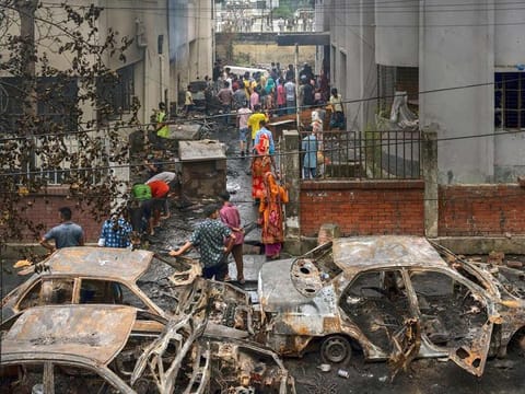 Damaged vehicles following a protest in Dhaka, Bangladesh, on Tuesday, August 6, 2024.