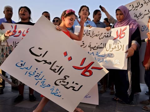 Women demonstrate against female child marriages in Tahrir Square in central Baghdad.