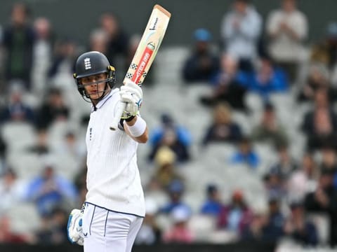England's Jamie Smith celebrates his half-century on day two of the first Test match against Sri Lanka at Old Trafford cricket ground in Manchester, north-west England on Thursday.