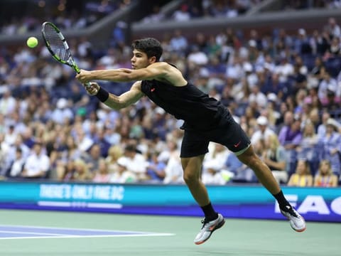 Carlos Alcaraz of Spain returns against Li Tu of Australia during their Men's Singles First Round match on Day Two of the 2024 US Open at the USTA Billie Jean King National Tennis Center on Tuesday.