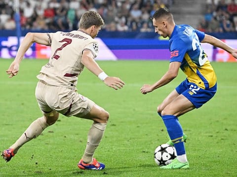 Salzburg’s defender #02 Ignace Van der Brempt (L) and Dynamo Kyiv's midfielder #22 Vladyslav Kabayev vie for the ball during the UEFA Champions League qualification 2nd-leg play-off match in Salzburg, Austria on August 27, 2024.