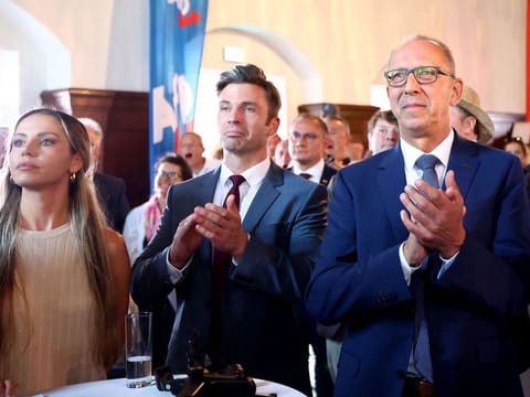 Joerg Urban (right), top candidate of the far-right Alternative for Germany party (AfD) reacts after the first exit polls during the party's election night in Dresden, eastern Germany, on September 1, 2024.