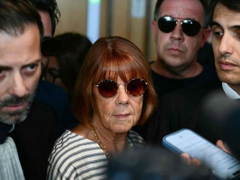 Gisele Pelicot (centre) exits the courtroom after attending a session of the trial of her former partner Dominique Pelicot accused of drugging her for nearly ten years and inviting strangers to rape her at their home in Mazan.