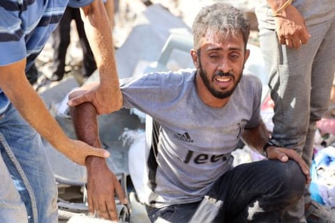 A Palestinian man reacts at the site of an Israeli strike in the Shejaiya suburb east of Gaza City on September 12, 2024, amid the ongoing war between Israel and Palestinian militants.