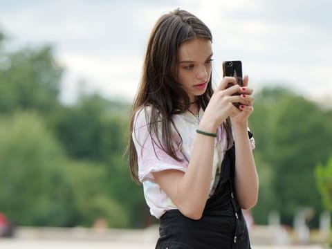 Illustrative image. Problematic social media use is defined as when young people present 'addiction-like symptoms,' the WHO says.