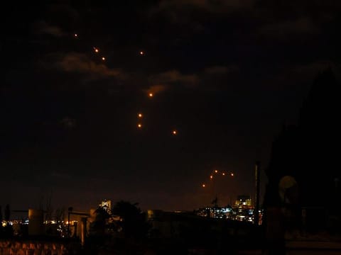 Israel intercepted missiles launched by Iran above Tel Aviv on Tuesday. Air raid sirens sounded in central Israel, the military said, as it launched ground operations into southern Lebanon targeting Hezbollah positions.